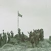 Raising the flag at Atlas Cove, Heard Island