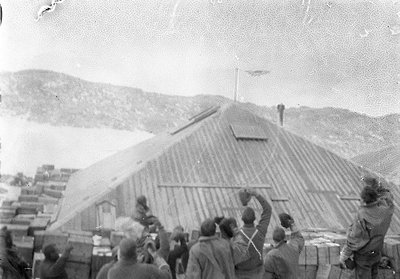 Cheering and hoorays for the completion of the Main Hut in March 1912