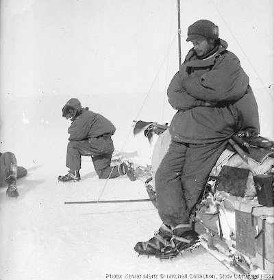 Mawson rests at the side of the sledge