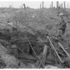 Leslie Blake inspecting the effect of a 9.2-inch British shell on a German reinforced concrete dugout on Hill 60 (Ypres), August 1917